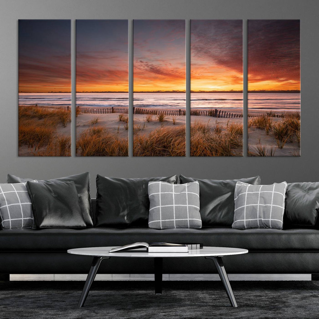 Sunset on The Beach Wall Art Canvas Print features a triptych of a beach at sunset with vivid orange skies, presented on museum-quality canvas. Each section is gallery wrapped, offering lasting beauty with its UV-protective coating.