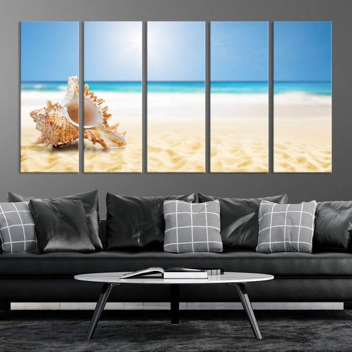 The Sea Shell on The Beach Sun Sand Wall Art Canvas Print is a triptych that beautifully captures a beach scene with a large seashell on the sand.