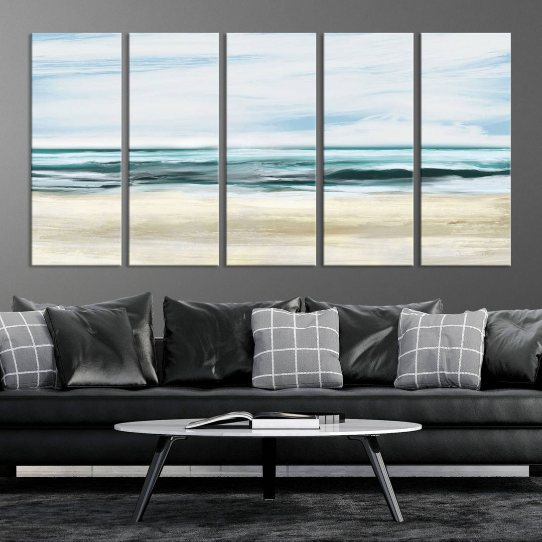 The room features the Ocean Abstract Wall Art Canvas Print, a triptych beach painting on museum-quality canvas with a gallery-wrapped finish and UV-protective coating.