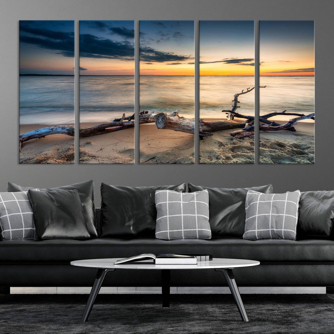 A captivating piece of Ocean Sunset Beach Wall Art Canvas Print, gallery wrapped, graces the gray wall.