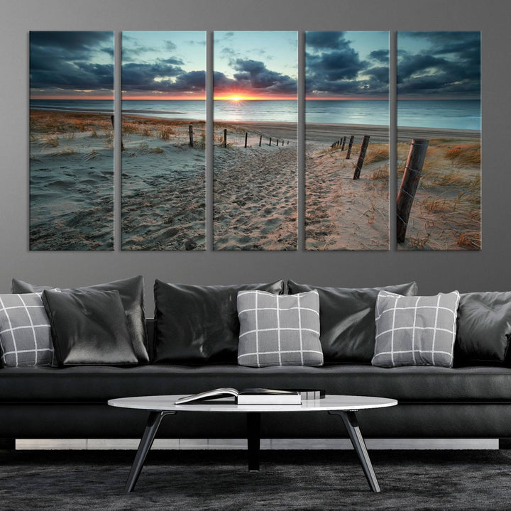 The modern living room features the Cloudy Weather Sunset Beach Wall Art Canvas Print. This museum-quality canvas adds a touch of sophistication with its hand-assembled framed art, ensuring lasting elegance. Enjoy free shipping on this exquisite piece.