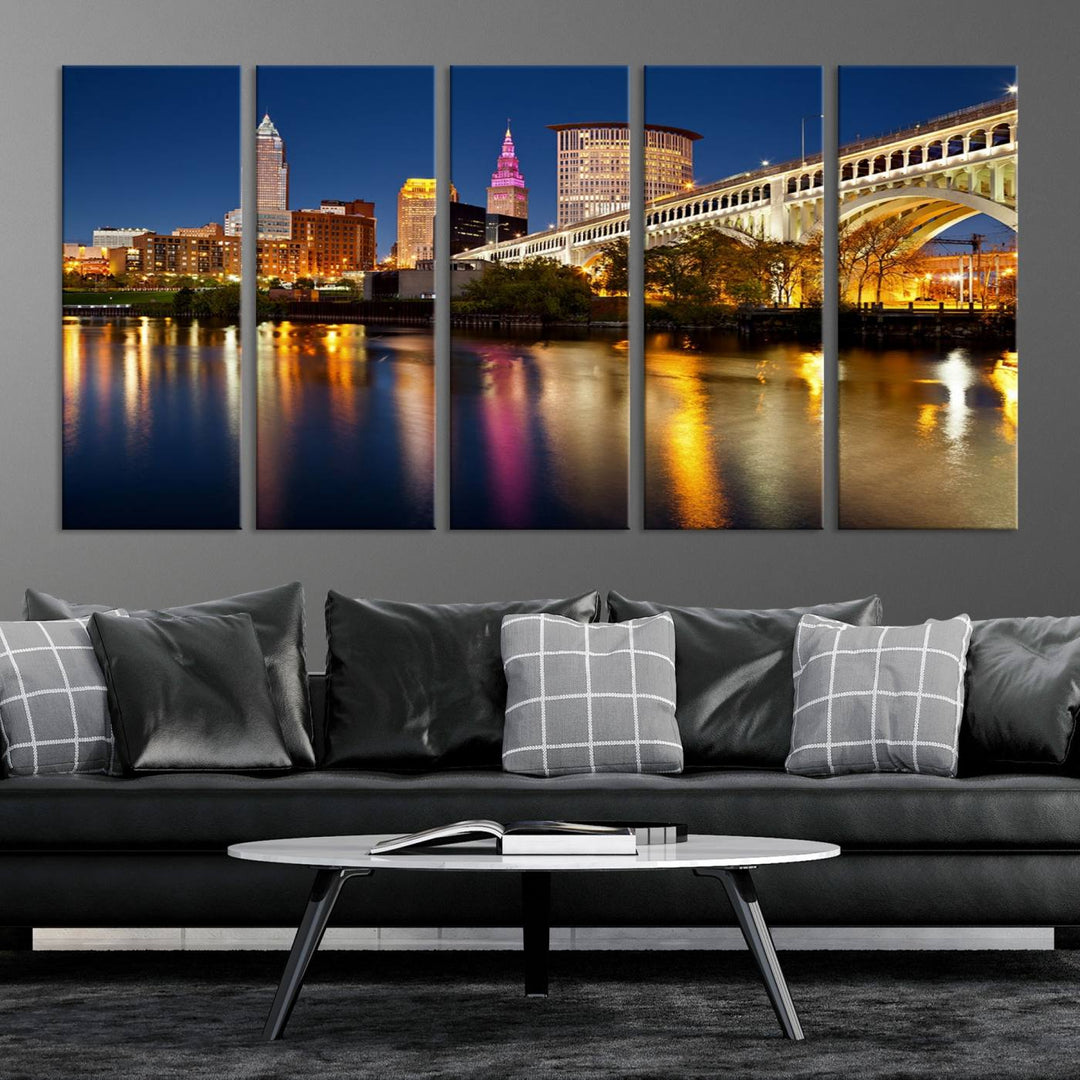 The "Cleveland Night Skyline Wall Art City Cityscape Canvas Print" is a striking feature in the room, showcasing a city skyline with a bridge reflecting in a river. Displayed on museum-quality canvas, it offers enduring beauty.