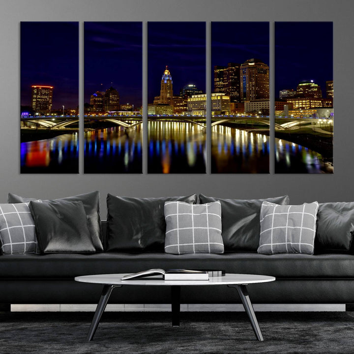 The "Columbus City Lights Night Skyline Cityscape View Wall Art Canvas Print" showcases a stunning city skyline at night, with illuminated buildings and bridges reflecting in the river, on a museum-quality canvas ready to hang.