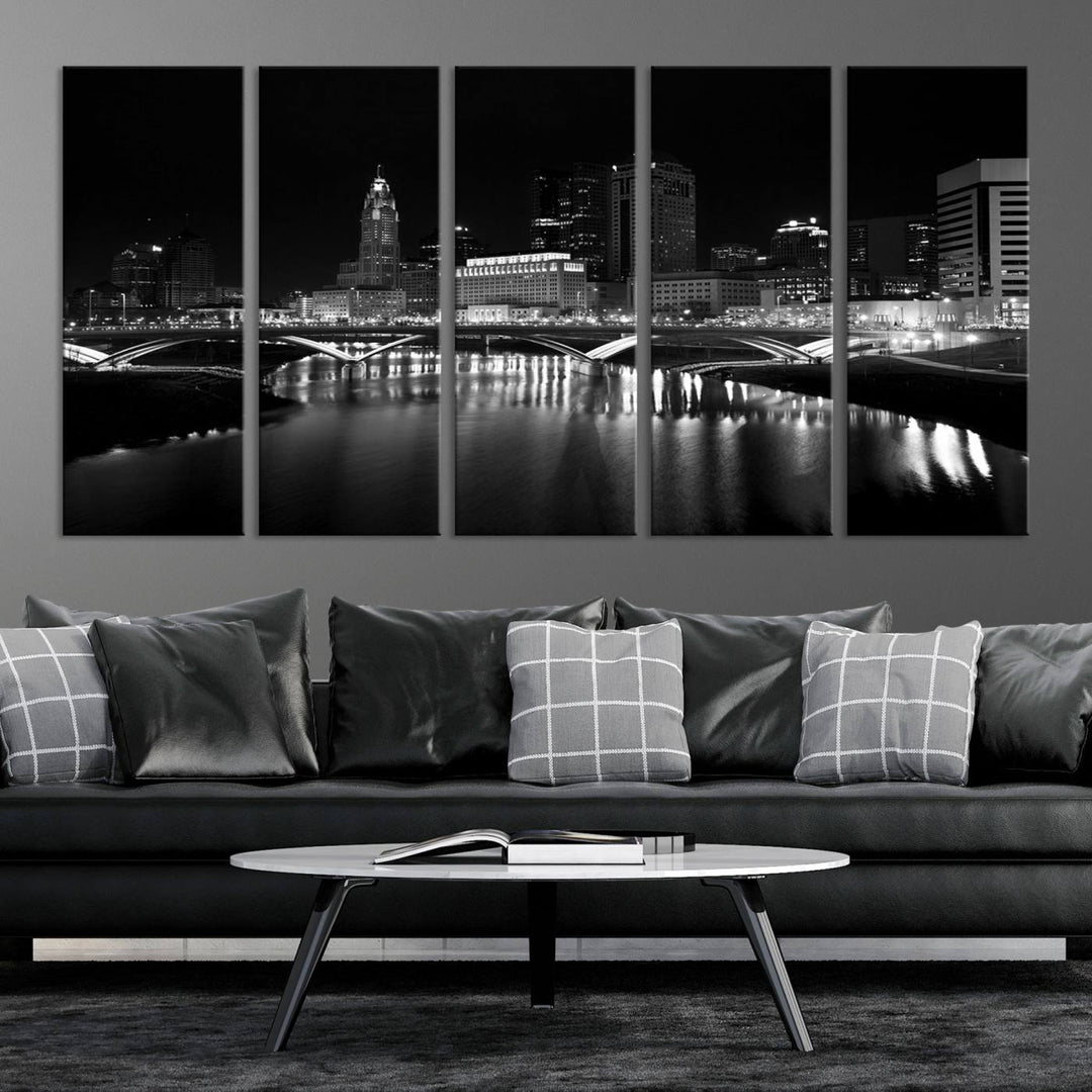 The living room features the "Columbus City Lights Skyline Black and White Wall Art Cityscape Canvas Print" above a coffee table. This artwork is presented as a triptych on museum-quality canvases with UV-protective coating.