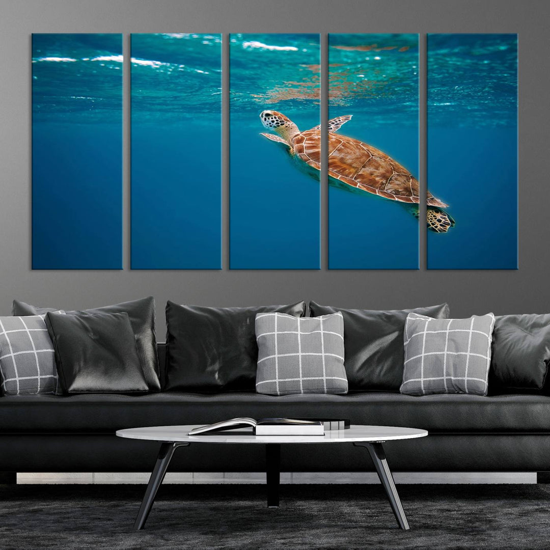 The living room features the "Baby Turtle in Ocean" wall art canvas print. This gallery-quality piece, depicting a sea turtle swimming underwater, adds an elegant touch to the space.