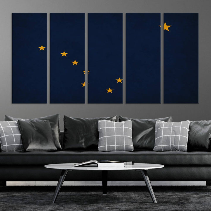 A contemporary living room featuring a triptych artwork of stars on a navy background, accentuated by the striking Alaska States Flag Wall Art Canvas Print.