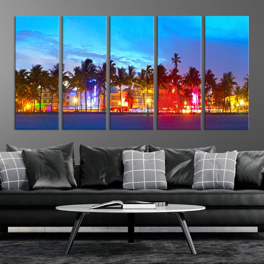 The living room features a three-panel Miami City Wall Art Canvas Print, showcasing a colorful, illuminated beach scene with palm trees on museum-quality canvas.