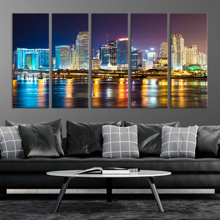 The Wall Art MIAMI Canvas Print features a stunning triptych of a city skyline at night, with vibrant lights reflecting on the water. This gallery-wrapped piece on museum-quality canvas delivers an exquisite finish.