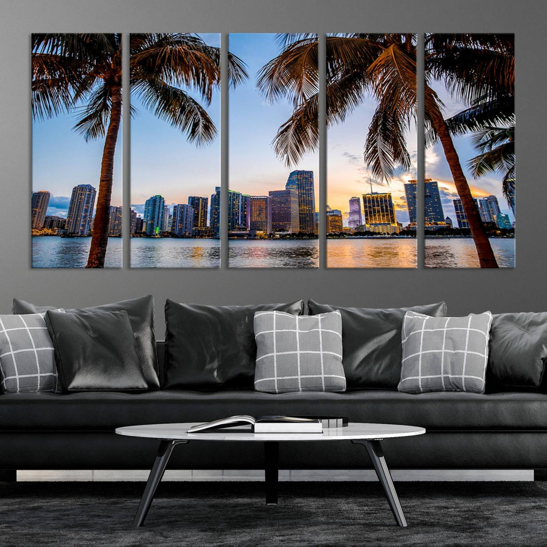 The Wall Art MIAMI Canvas Print features a triptych design depicting palm trees and a city skyline at sunset.