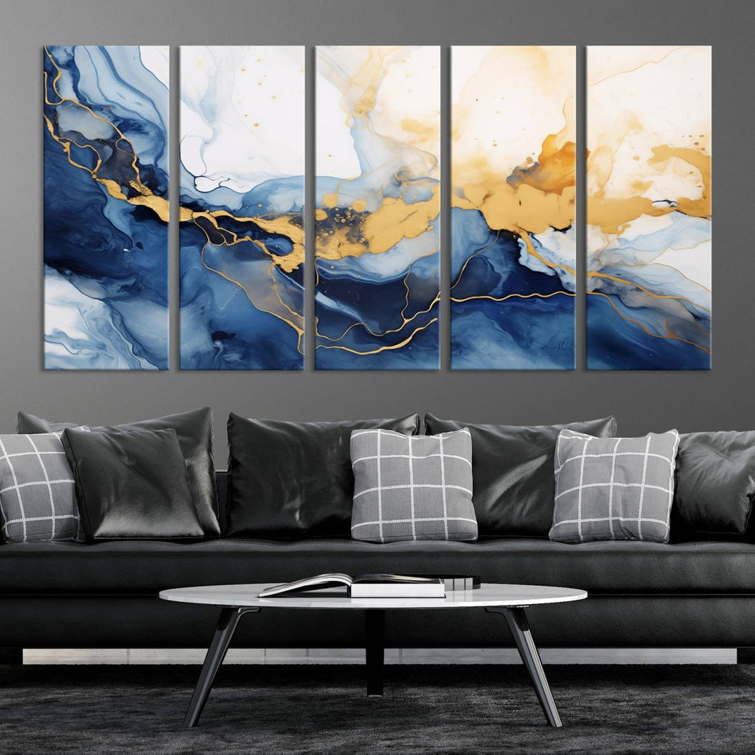 A contemporary living room featuring the "Navy Blue Gold Abstract Wall Art Canvas Print" on the wall, displayed on a gallery-wrapped, museum-quality canvas.