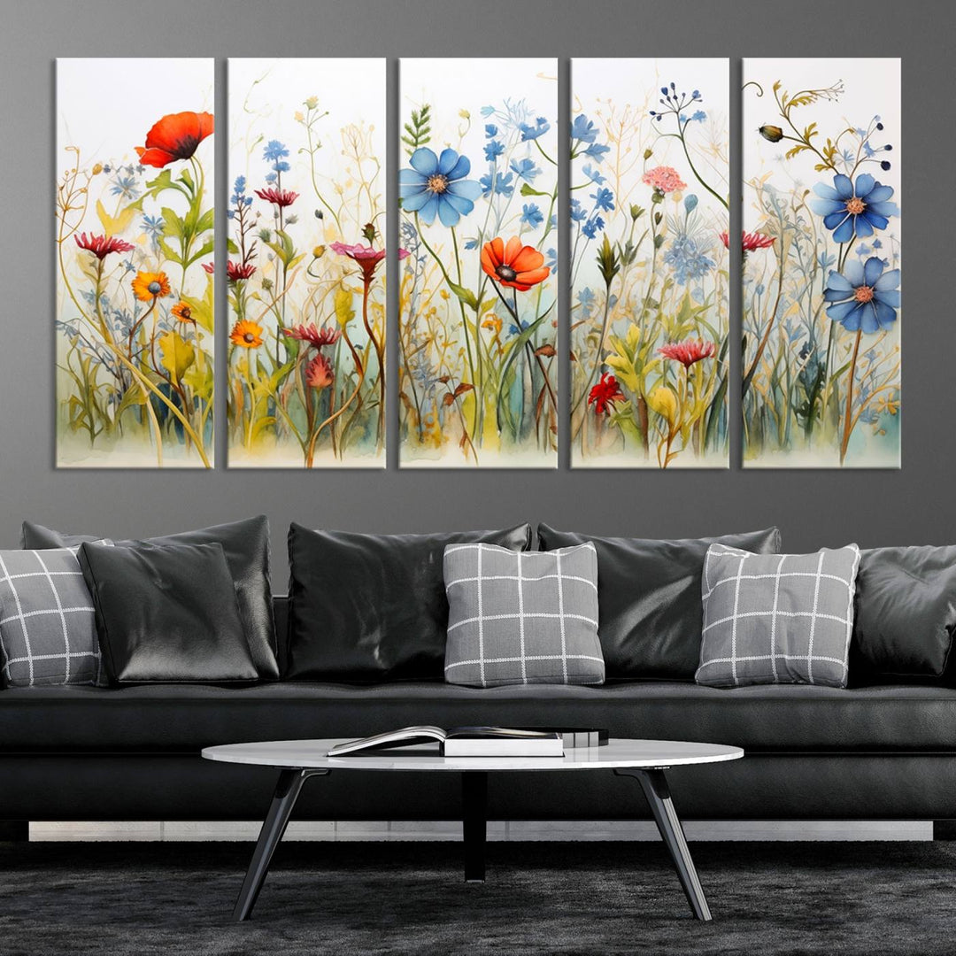 The Colorful Wildflower Canvas Wall Art – Vibrant Floral Botanical Print, consisting of a large 3 panel set, adds bright nature decor to the living room against a black wall.