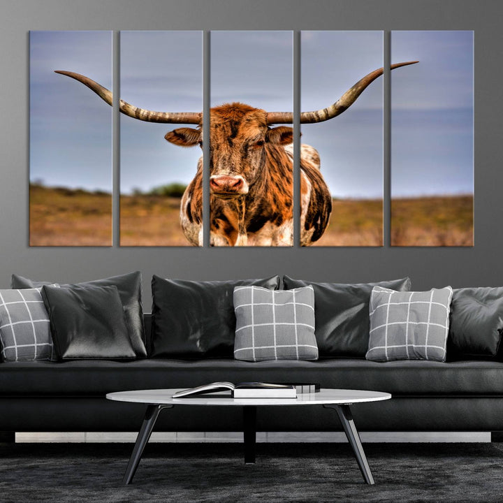 The Texas Longhorn Wall Art Print, a triptych canvas artwork depicting a longhorn bull in a field, features a gallery-quality finish.