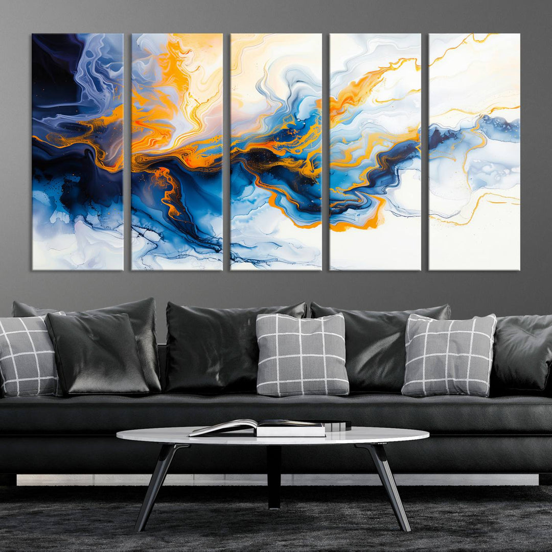 A stunning Fluid Alcohol Ink Wall Art with Gold Wall Art Canvas Print, featuring vibrant blue, orange, and white swirls, adorns the wall. This gallery-quality finish adds an exquisite touch to any living space.