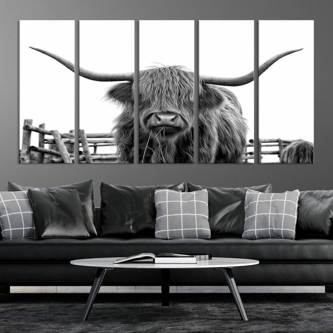 The Longhorn Canvas Print, featuring a black-and-white triptych of a Bighorn cow with shaggy fur and impressive long horns, is elegantly showcased. This wall art piece boasts a gallery-quality finish on premium canvas, bringing sophistication to any room.