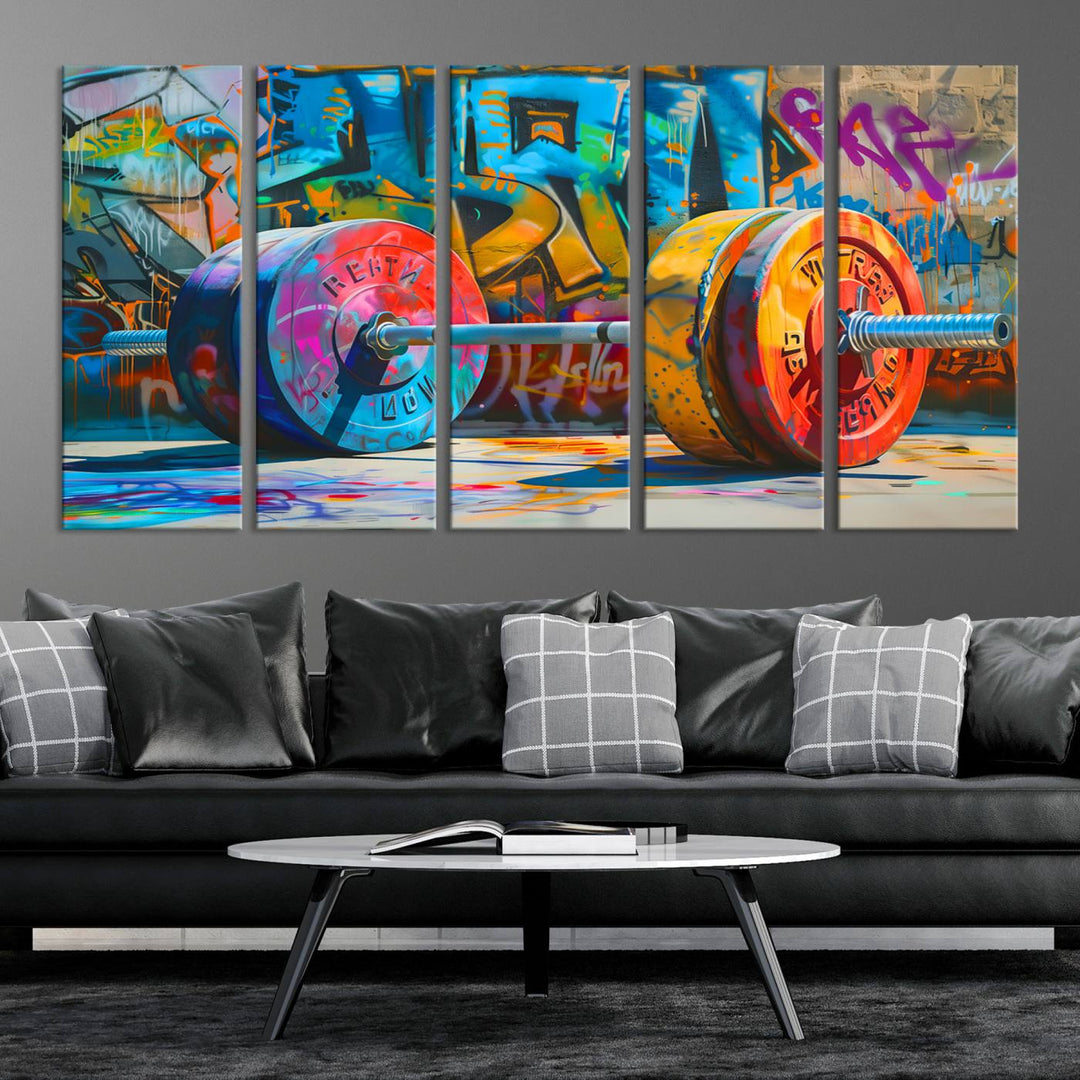 The Fitness Gym Barbell Graffiti Wall Art Canvas Print, a vibrant triptych featuring a barbell against a graffiti backdrop, elegantly hangs in the room. Crafted on premium canvas with a gallery-quality finish, this stunning piece of wall art effortlessly combines urban flair with sophisticated decor.