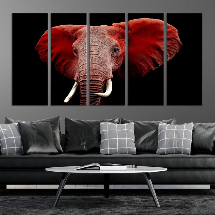 A Wall Art Canvas Print in the modern living room features a three-panel premium design of a red elephant face.