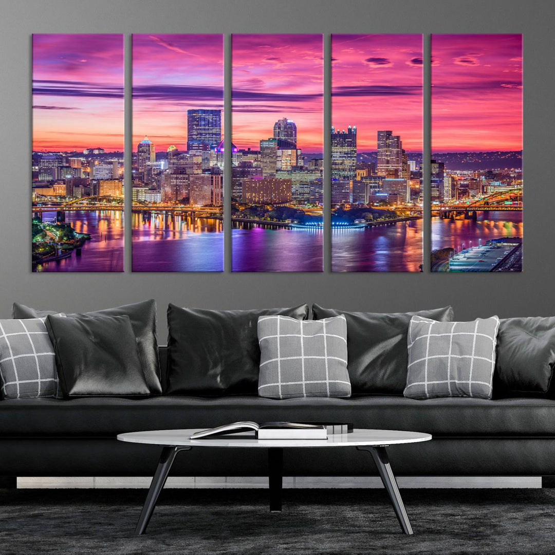 The Pittsburg Wall Art Canvas Print, showcasing a vibrant sunset glow over the city skyline and crafted by a professional artisan, adorns the space.