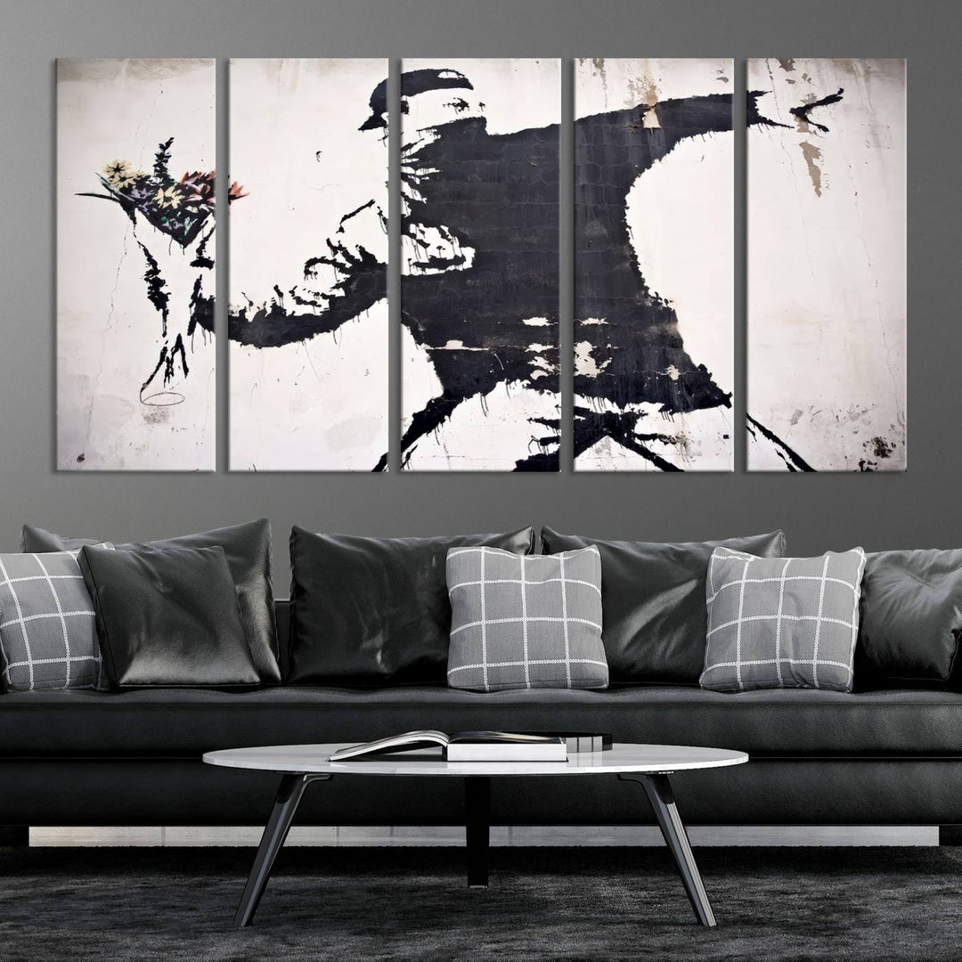 The living room features a split-panel art piece named "Banksy Flower Throw Graffiti Street Wall Art Canvas Print," gallery wrapped on museum-quality polycotton canvas and accentuated by modern decor elements.