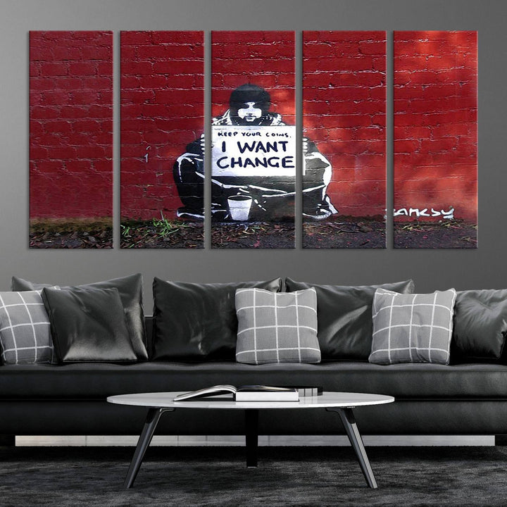 The living room showcases a triptych of stencil artwork on museum-quality canvas, featuring the Banksy I Want Change Graffiti Abstract Wall Art Canvas Print. This captivating piece depicts a person holding a sign that says "I want change" and is finished with a UV-protective coating to ensure long-lasting beauty.