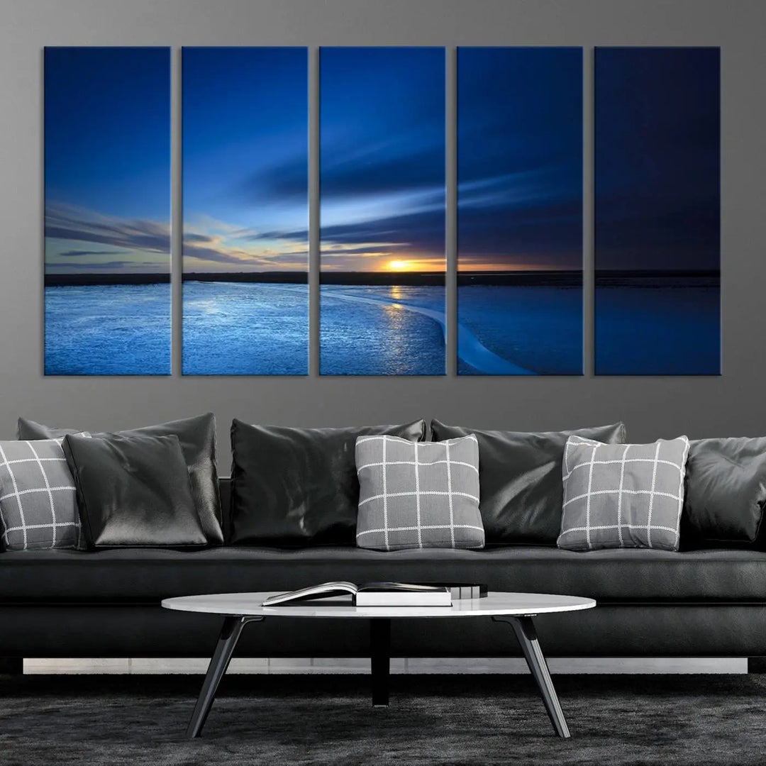 The living room features a triptych of the Wall Art Canvas Print Navy Sunset Lake Landscape Artwork, adding to its tranquil vibe.