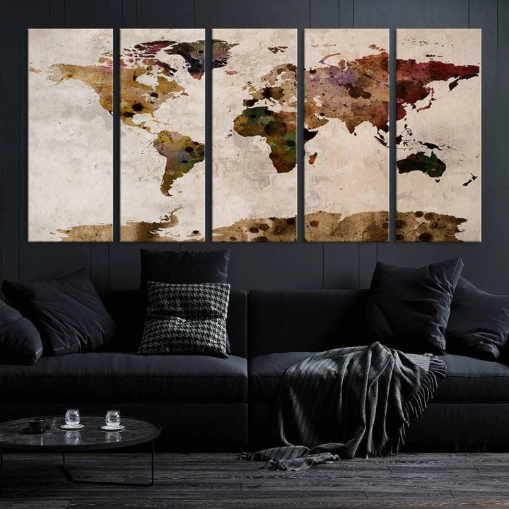 A Watercolor World Map Canvas Print, wrapped in an elegant gallery style, hangs on the wall.