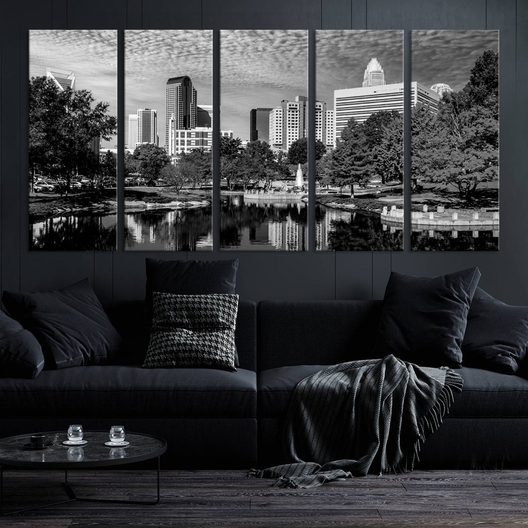 The living room features a captivating triptych titled "Charlotte City Cloudy Skyline Black and White Wall Art Cityscape Canvas Print," crafted on museum-quality canvas with UV-protective coating. Modern decor accentuates the dynamic scene.