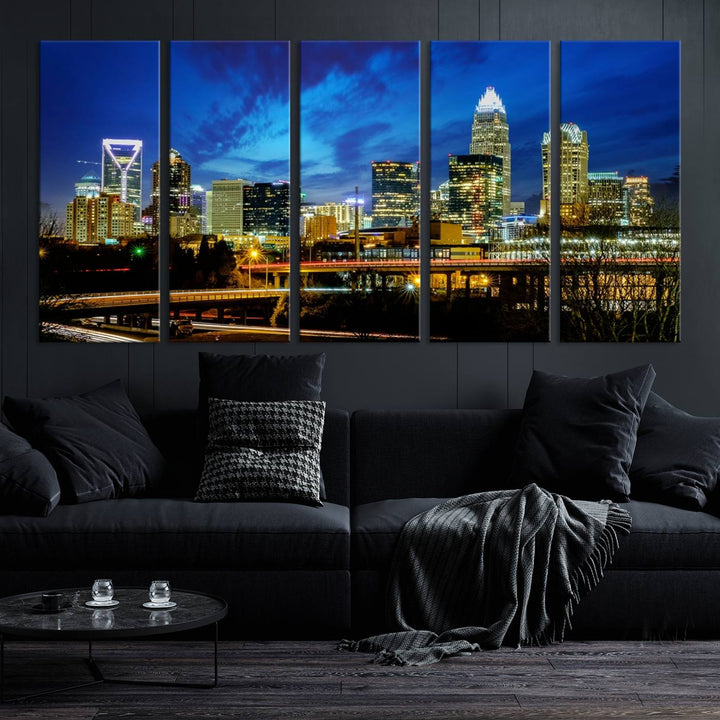 A modern living room highlighted by the "Charlotte City Lights Cloudy Blue Night Skyline Cityscape View" wall art canvas print, crafted on museum-quality canvas with UV-protective coating.