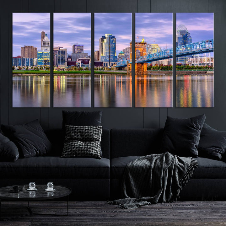 The wall art titled "Cincinnati City Lights Sunset Purple Cloudy Skyline Cityscape View" is beautifully printed on museum-quality canvases with a UV-protective coating and is ready to hang.