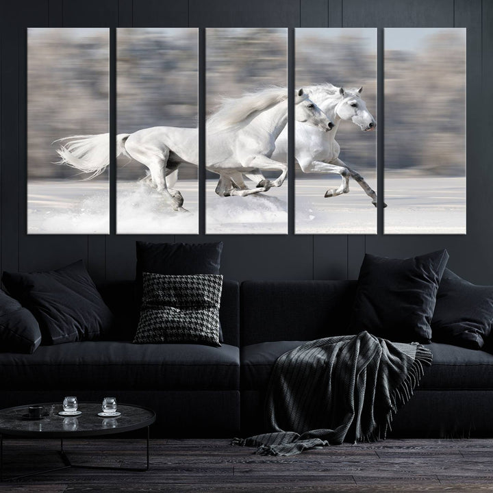 The "All The White Horses Wall Art Canvas Print" depicts a triptych of galloping white horses across a snowy landscape. These museum-quality canvases come with a UV-protective coating to maintain their stunning appearance over time.