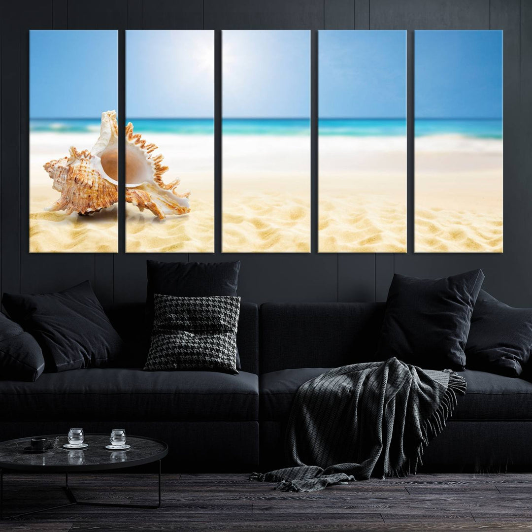 The Sea Shell on The Beach Sun Sand Wall Art Canvas Print is a triptych that beautifully captures a beach scene with a large seashell on the sand.