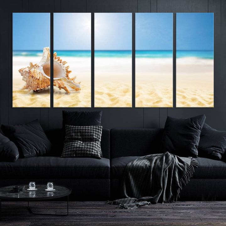 The Sea Shell on The Beach Sun Sand Wall Art Canvas Print is a triptych that beautifully captures a beach scene with a large seashell on the sand.