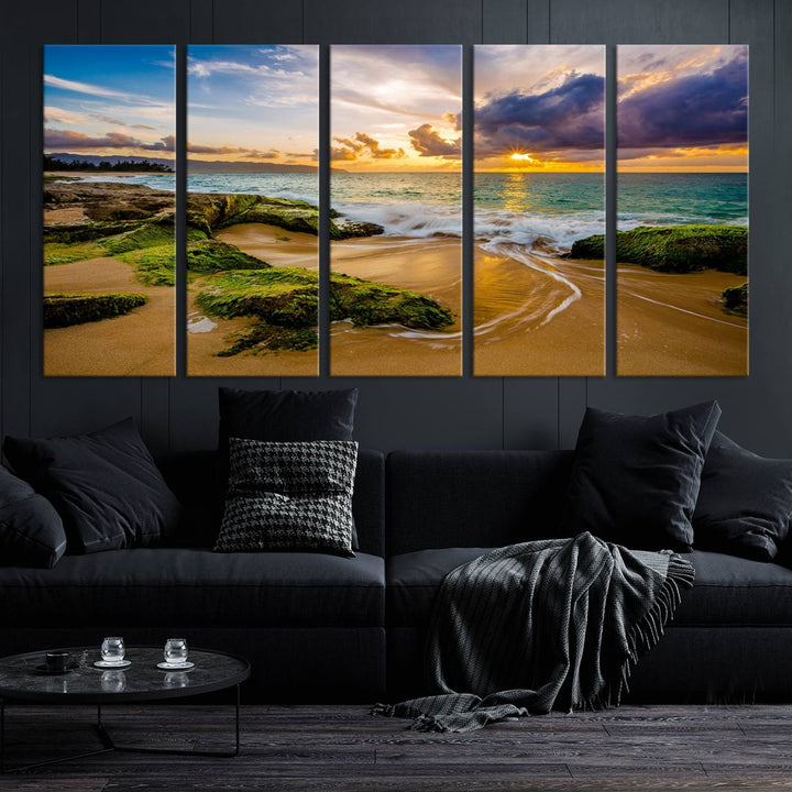 The Sunset Beach Wall Art Canvas Print is a gallery-wrapped triptych showcasing a beach scene with mossy rocks and a vibrant sunset. Made from museum-quality canvas and featuring a UV-protective coating, it elegantly provides both beauty and durability.