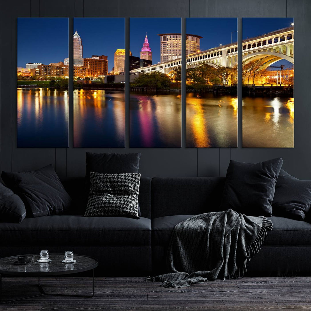 The "Cleveland Night Skyline Wall Art City Cityscape Canvas Print" is a striking feature in the room, showcasing a city skyline with a bridge reflecting in a river. Displayed on museum-quality canvas, it offers enduring beauty.