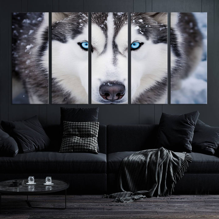 A large framed Winter Siberian Husky Wolf Wall Art Canvas Print, an exquisite piece of animal portrait decor, hangs prominently on the wall.