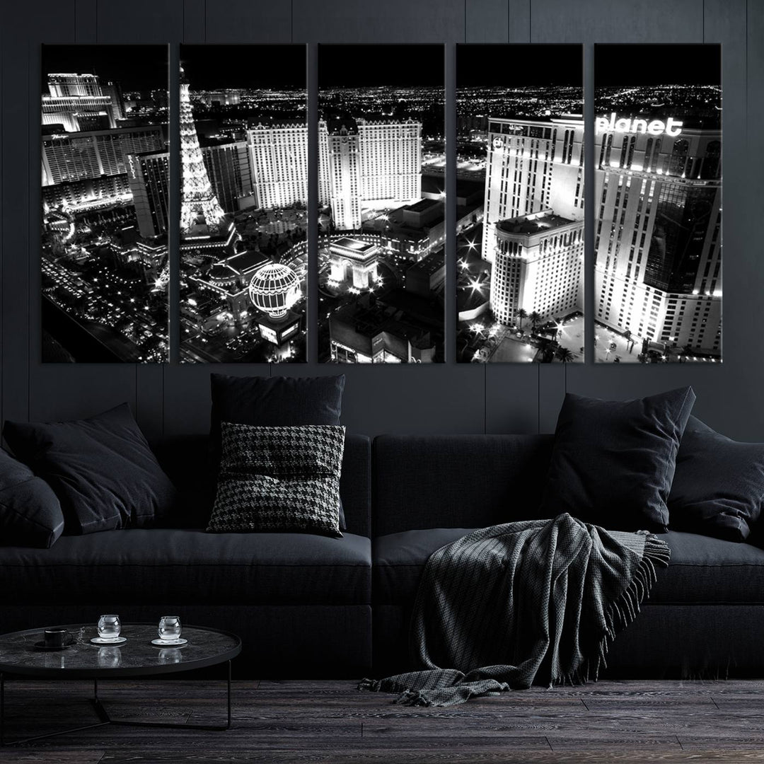 The Las Vegas Wall Art Canvas Print is a black and white triptych that showcases a city skyline at night. Crafted on museum-quality canvas with a UV-protective coating, it serves as an elegant and ready-to-hang focal point in the room.