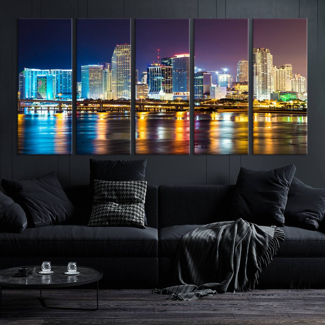 The Wall Art MIAMI Canvas Print features a stunning triptych of a city skyline at night, with vibrant lights reflecting on the water. This gallery-wrapped piece on museum-quality canvas delivers an exquisite finish.