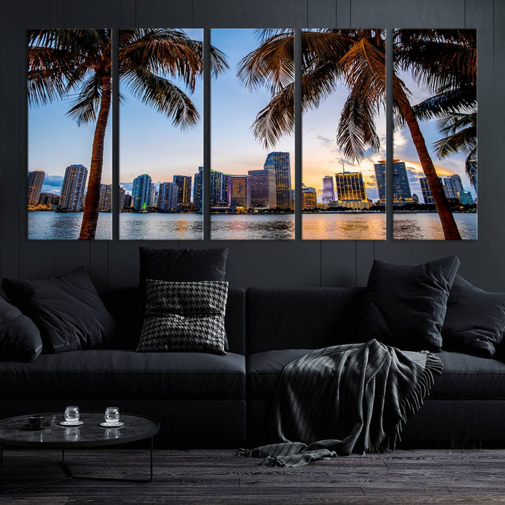 The Wall Art MIAMI Canvas Print features a triptych design depicting palm trees and a city skyline at sunset.