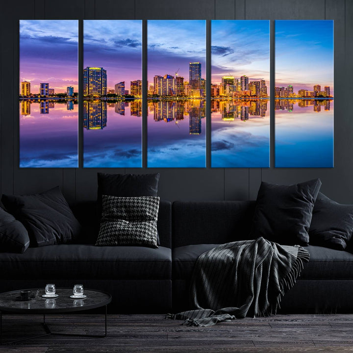 The Miami City Wall Art Canvas Print, featuring a three-panel depiction of a city skyline at sunset reflected in water, beautifully enhances the wall. Made with museum-quality canvas and a UV-protective coating, it comes ready to hang.