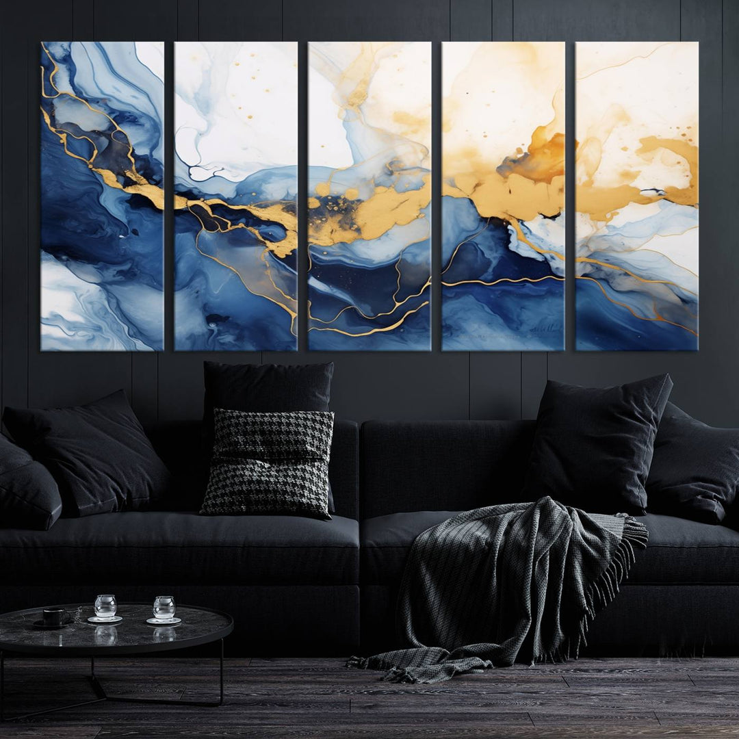 A contemporary living room featuring the "Navy Blue Gold Abstract Wall Art Canvas Print" on the wall, displayed on a gallery-wrapped, museum-quality canvas.