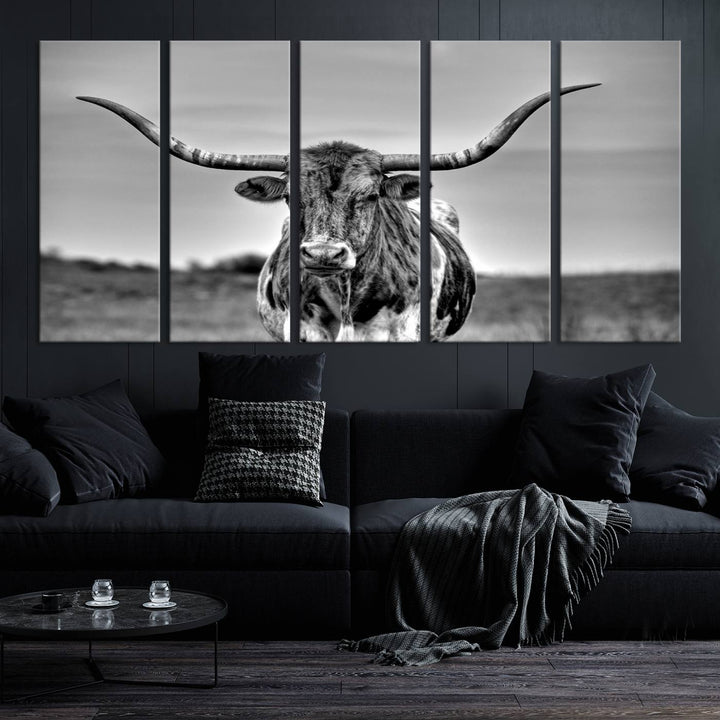 The Texas Longhorn Cow Wall Art, featuring a black and white image of a longhorn bull on canvas, brings charm to the room with its sophisticated appeal.