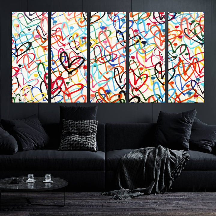 The Colorful Graffiti Love Canvas Print, a street art masterpiece with vibrant abstract swirls and a gallery-quality finish, hangs prominently on the wall.