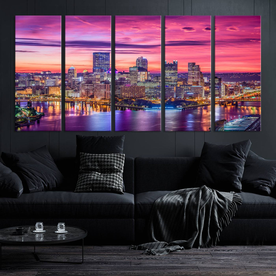 The Pittsburg Wall Art Canvas Print, showcasing a vibrant sunset glow over the city skyline and crafted by a professional artisan, adorns the space.