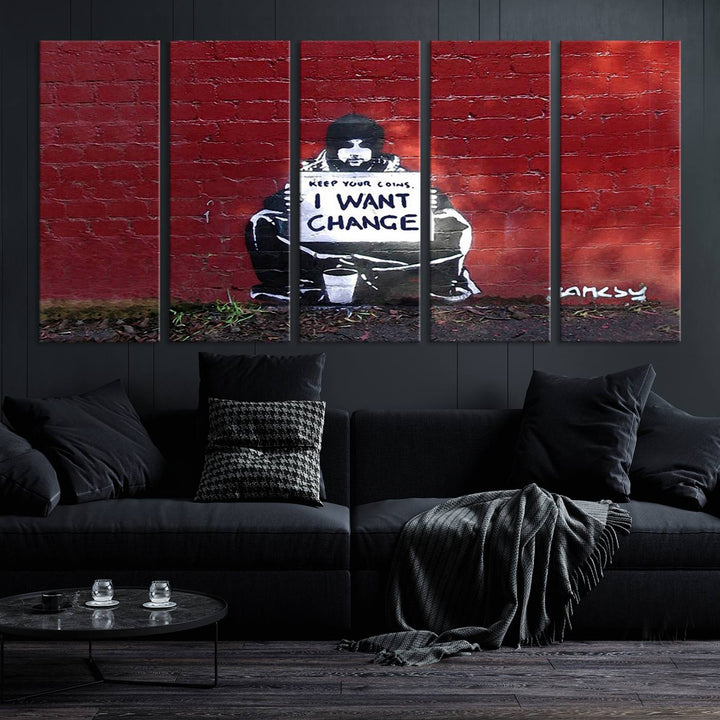 The living room showcases a triptych of stencil artwork on museum-quality canvas, featuring the Banksy I Want Change Graffiti Abstract Wall Art Canvas Print. This captivating piece depicts a person holding a sign that says "I want change" and is finished with a UV-protective coating to ensure long-lasting beauty.