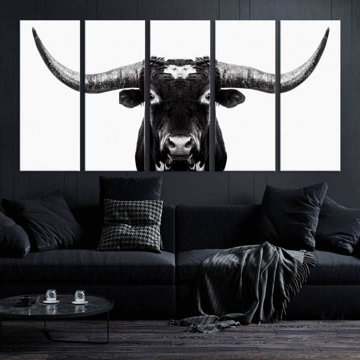 The living room is adorned with the Texas Cow Longhorn Wall Art Canvas Print in Black and White—framed and ready to hang.