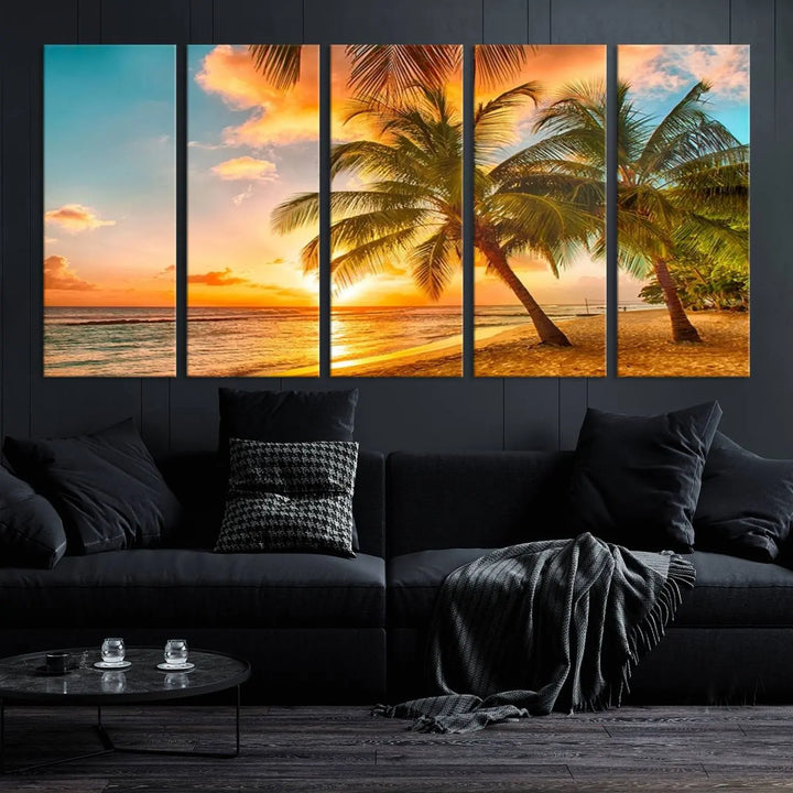 The Tropical Sunset Wall Art Print features a vibrant beach scene with palm trees and an ocean view highlighted by a golden sunset.