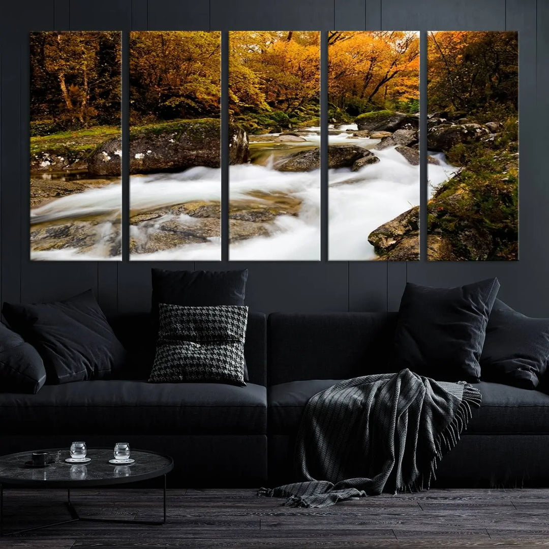 The living room is adorned with the "Wall Art Waterfall Canvas Print River in Forest in Autumn," a triptych on museum-quality canvas showcasing a flowing river surrounded by autumn trees. This ready-to-hang artwork features a UV-protective coating to ensure enduring vibrancy.