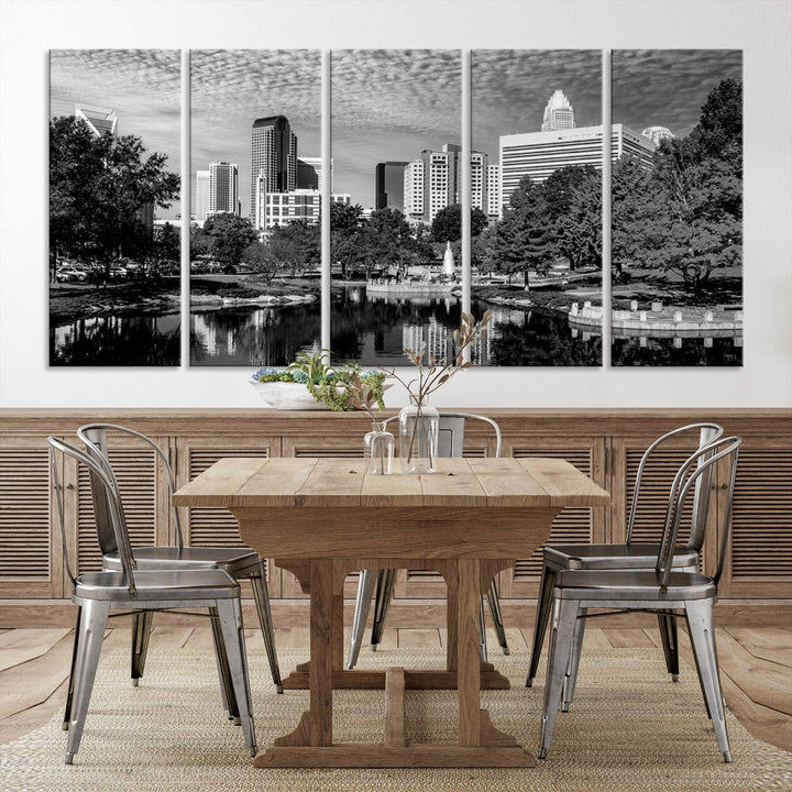 The living room features a captivating triptych titled "Charlotte City Cloudy Skyline Black and White Wall Art Cityscape Canvas Print," crafted on museum-quality canvas with UV-protective coating. Modern decor accentuates the dynamic scene.