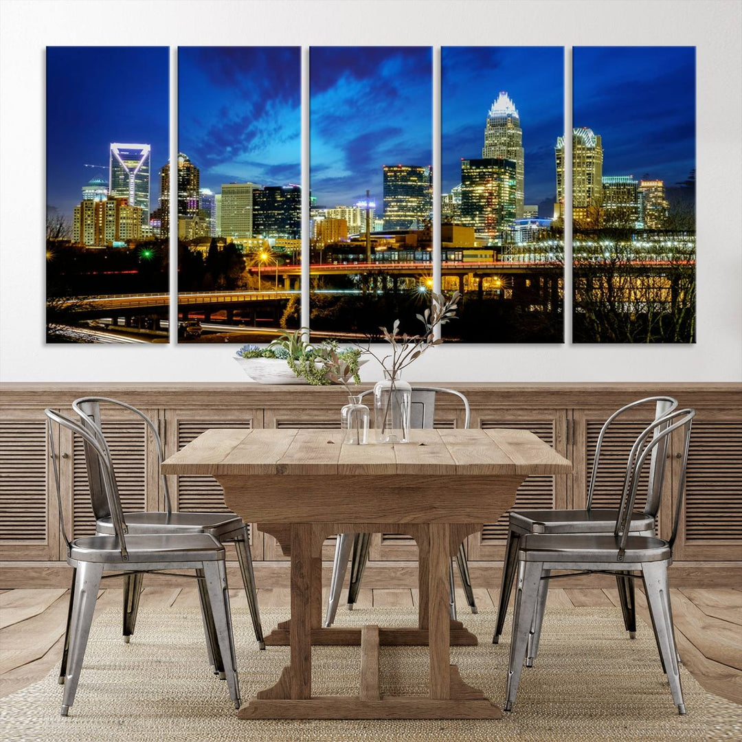 A modern living room highlighted by the "Charlotte City Lights Cloudy Blue Night Skyline Cityscape View" wall art canvas print, crafted on museum-quality canvas with UV-protective coating.