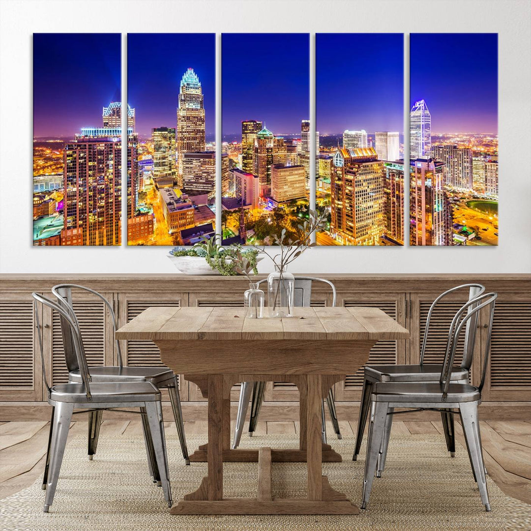 A modern living room features the Charlotte City Lights Night Blue Skyline Cityscape View wall art canvas print.