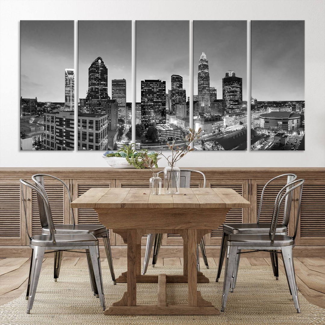 The "Charlotte City Cloudy Skyline Black and White Wall Art Cityscape Canvas Print" hangs on a dark wall, showcasing its UV-protective properties for enduring beauty.